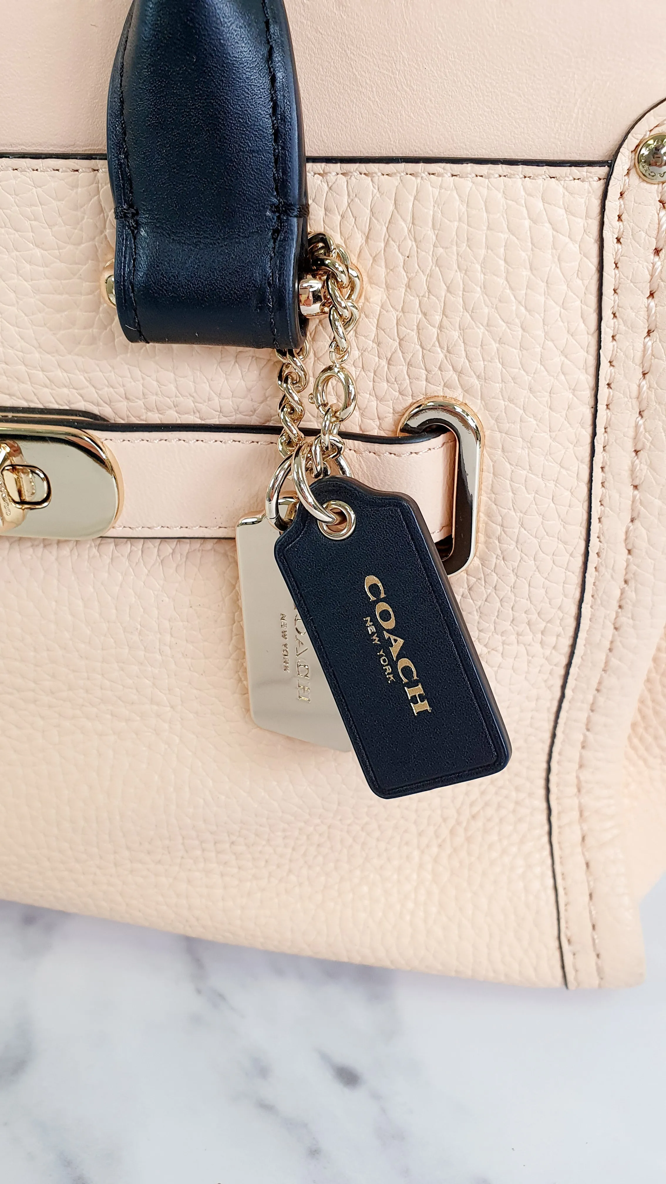 Coach Swagger 27 in Peach Salmon Pink with Colorblock Black Handles - Pebble Leather HandbagCrossbody Bag - Coach 34417