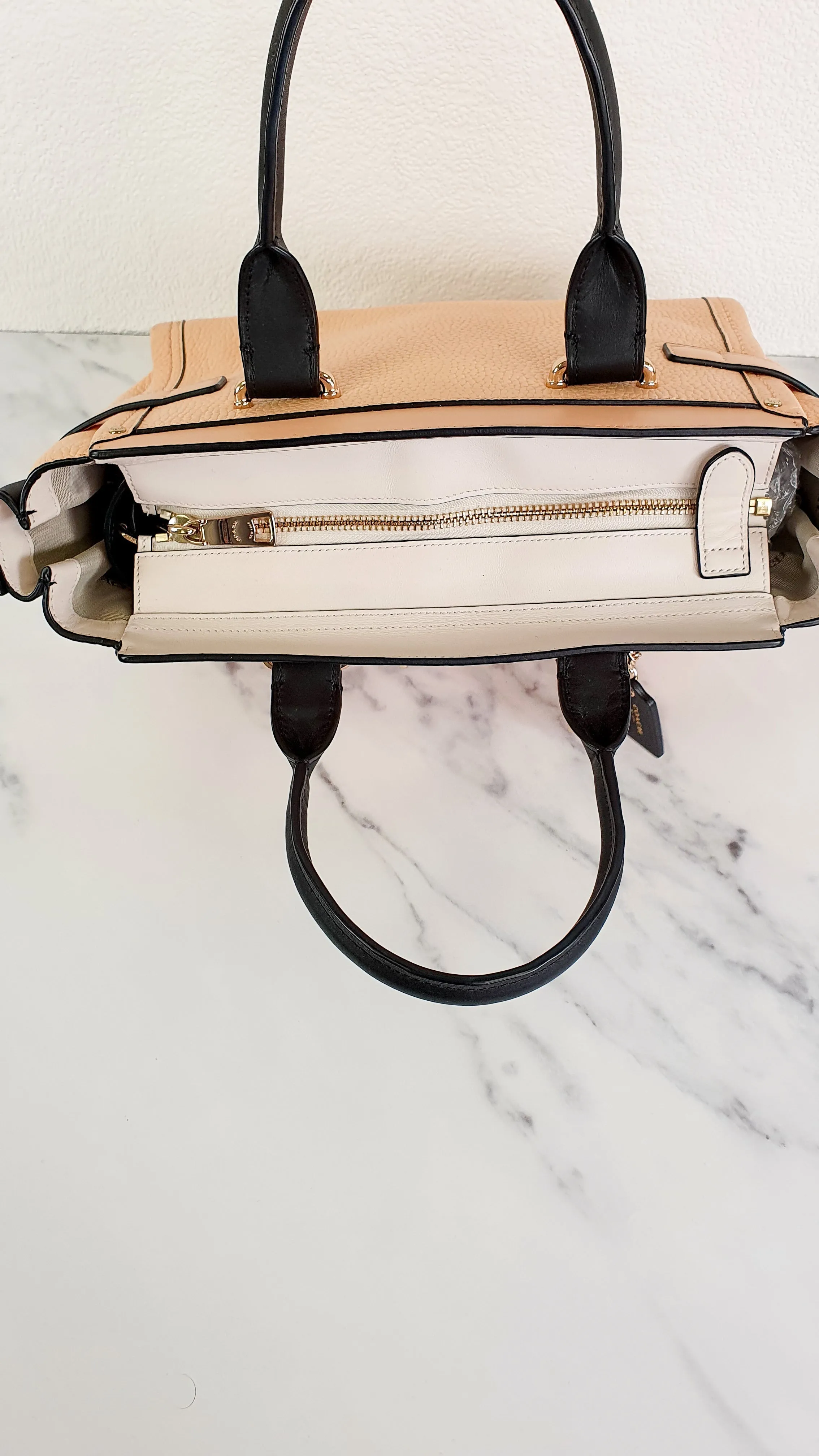 Coach Swagger 27 in Peach Salmon Pink with Colorblock Black Handles - Pebble Leather HandbagCrossbody Bag - Coach 34417
