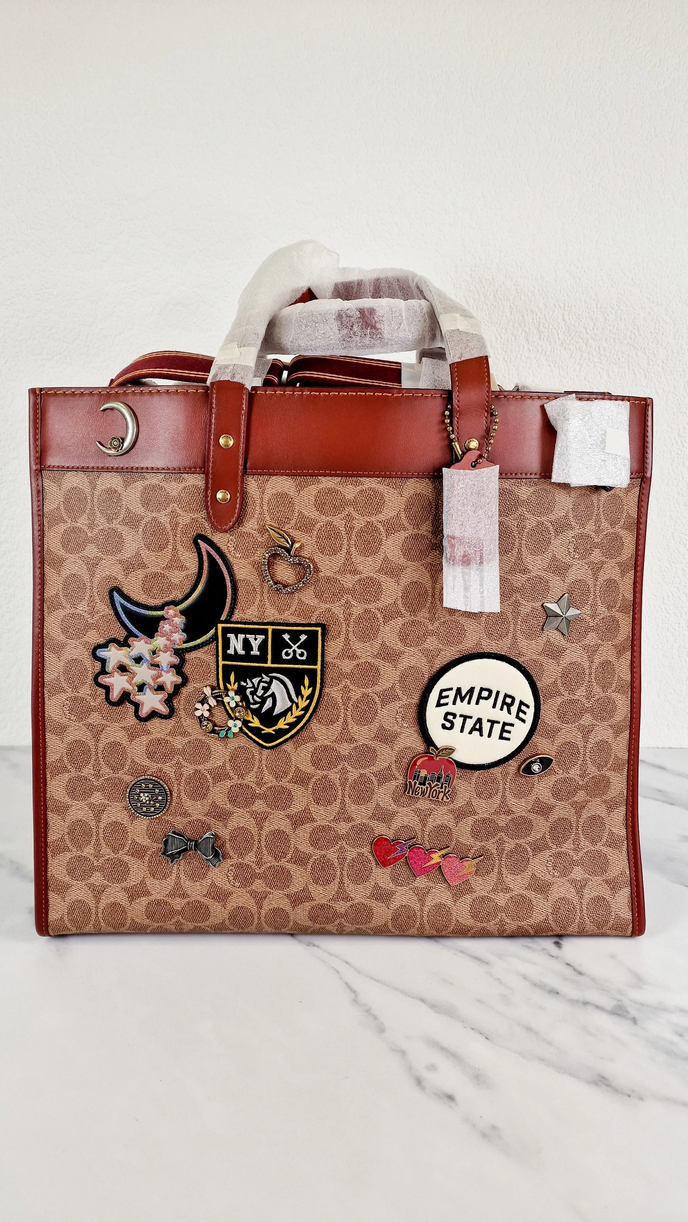 Field Tote 40 in Signature Canvas with Souvenir Patches and Pins Empire State Rexy - Tan Rust Saddle Brown Shoulder Bag Crossbody - Coach C0768